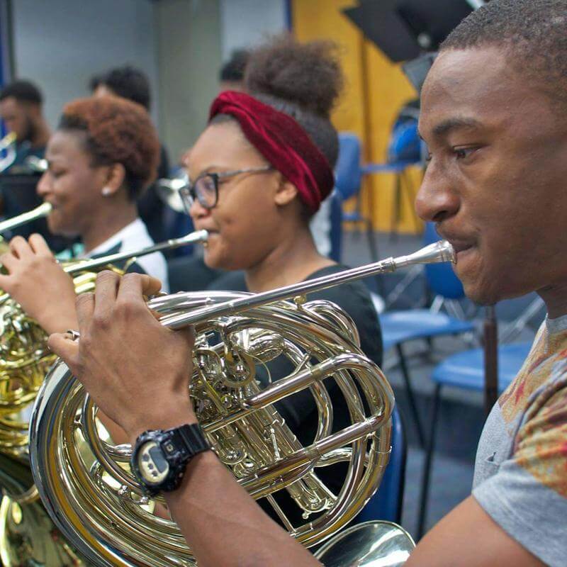 Brass instrument musicians practicing at the Department of Music.