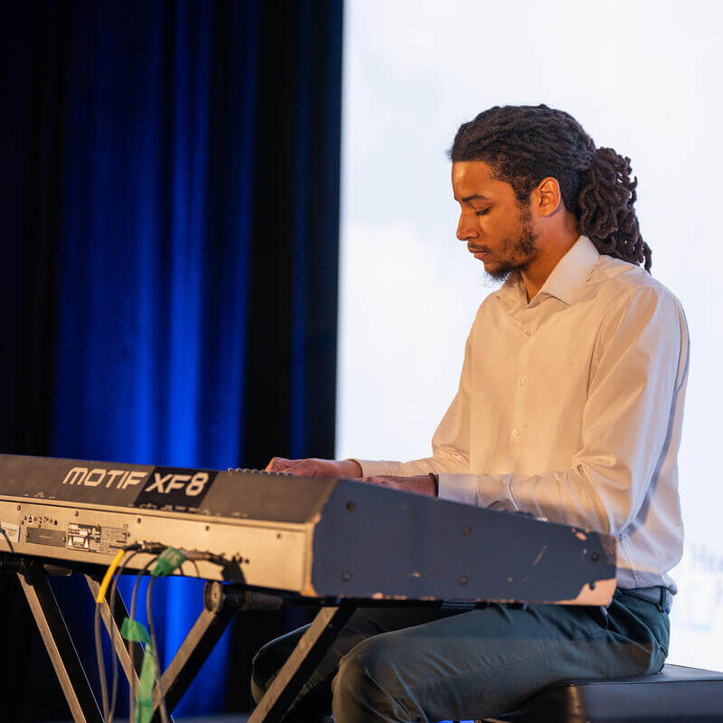 Student plays keyboard