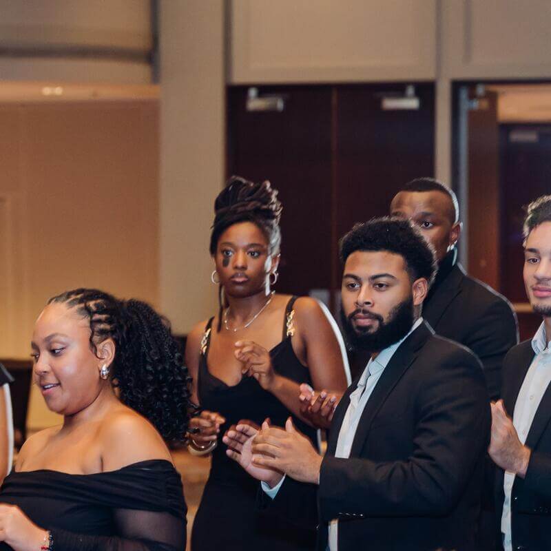 Students at formal conference event