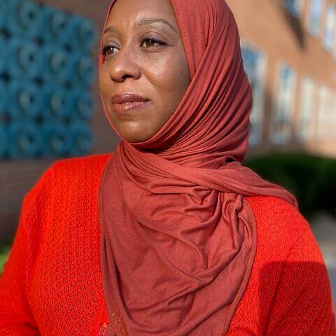 Coney-Ali in red hijab and red shirt