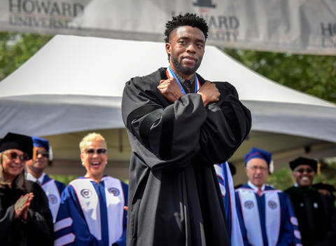 Actor and Howard alumnus Chadwick Boseman doing the Wakanda salute at Commencement 2018.