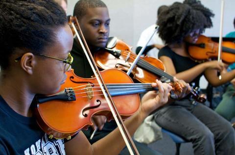 Violinists practicing at the Department of Music.