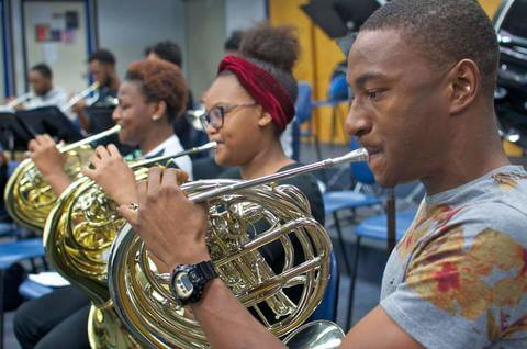 Brass instrument musicians practicing at the Department of Music.