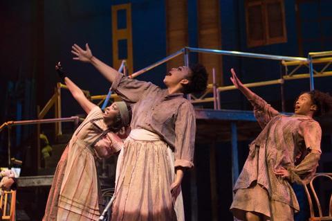 Howard University theatre arts students performing in costume.