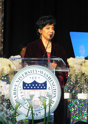 Phylicia Rashad speaking at a Howard University podium.