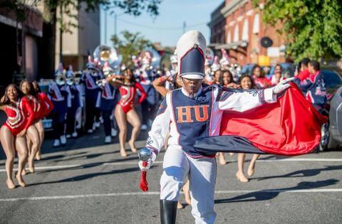 The Howard University Showtime marching band performing at a parade.