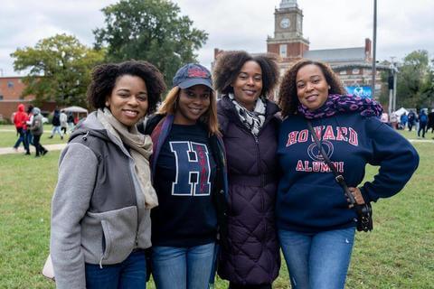 Four African American women with Howard University sweatshirts on an other clothing