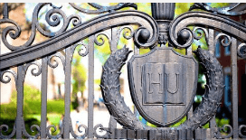 Stylized letters HU engraved on a metal gate