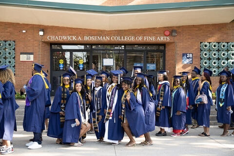 CABCoFA Graduate pose in front of Childers Hall