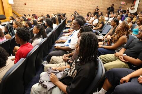 Students sit in audience