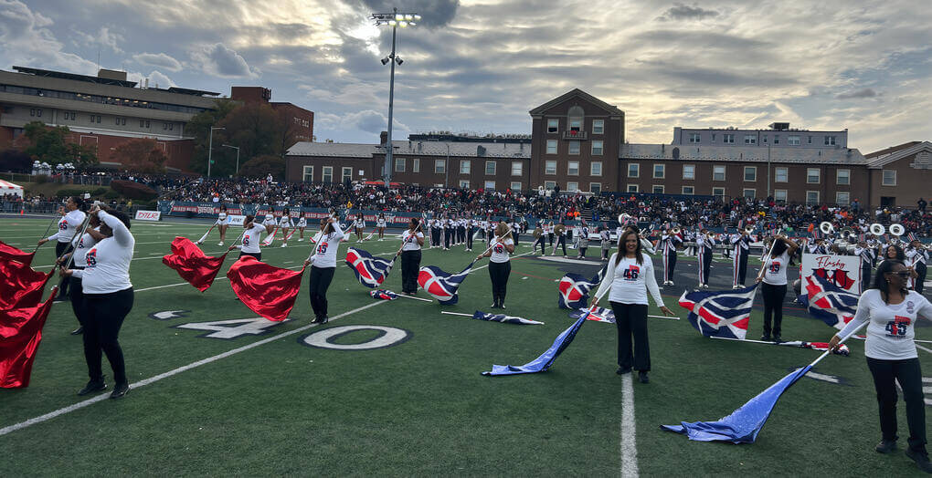 Flashy Flags: Past and Present perform at the 101st Homecoming