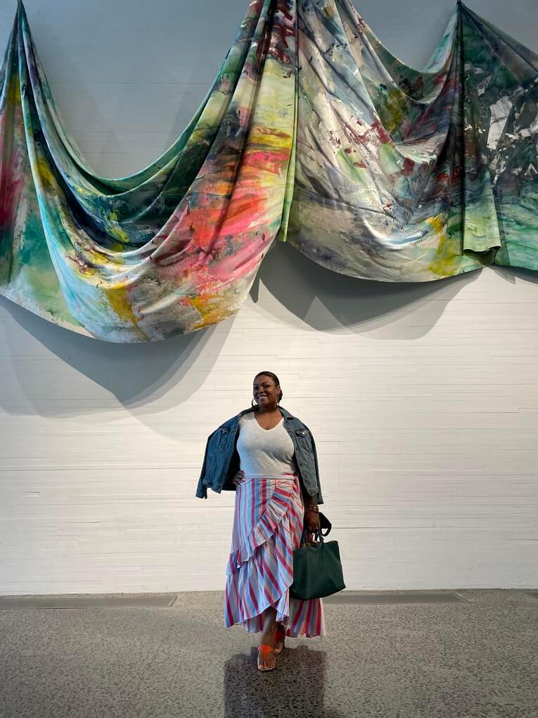 Tiffani Sydnor posed under a piece by Sam Gilliam