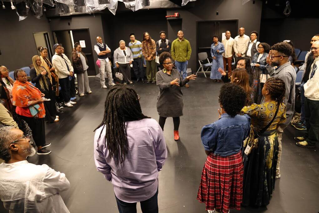 Dean Raquel Monroe speaks to the group