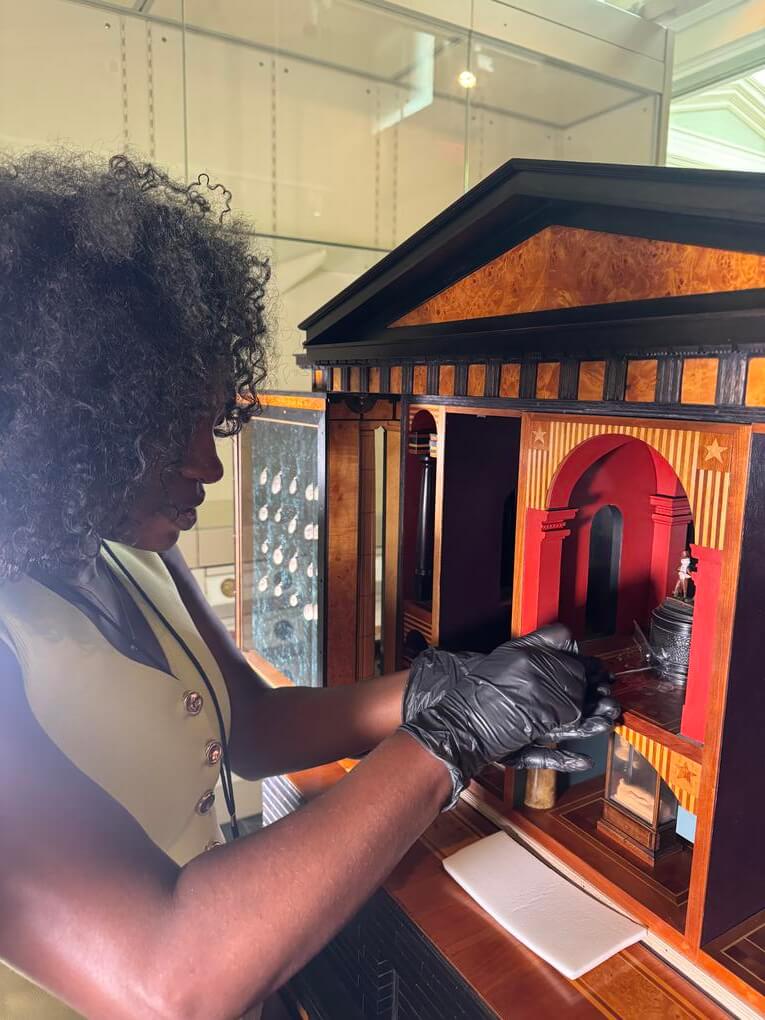 Recent Howard MFA graduate Mykayla Osborne works with one of the miniature components inside David Beck’s MVSEVM during her placement at the Smithsonian American Art Museum’s Lunder Conservation Center.